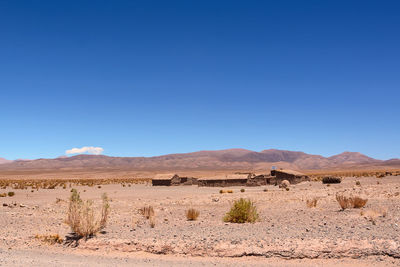 Scenic view of desert against clear sky