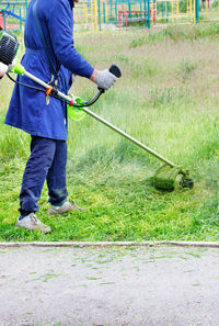 Low section of man working in lawn