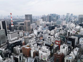 Aerial view of cityscape against sky