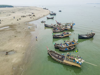 Boats moored at harbor