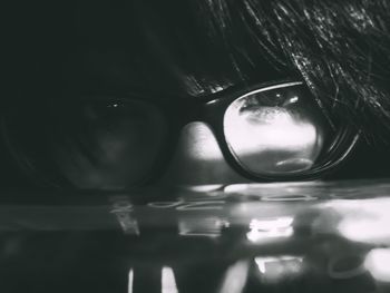 Close-up portrait of young woman swimming in water