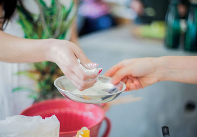 Close-up of hand holding ice cream