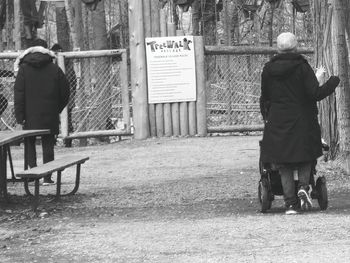 Rear view of men walking on street