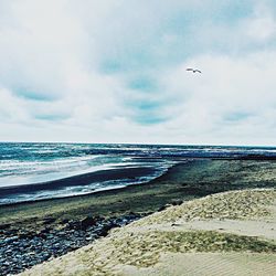 Scenic view of beach against sky