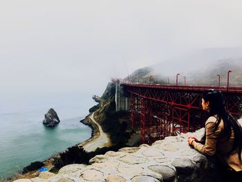 Man looking at sea against sky