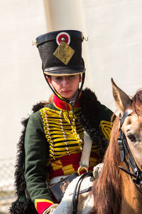 Portrait of boy riding horse