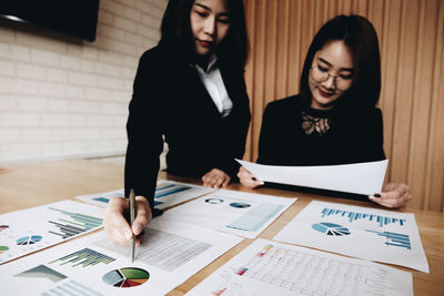 Businesswomen working on table