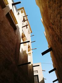 Low angle view of bell tower against sky