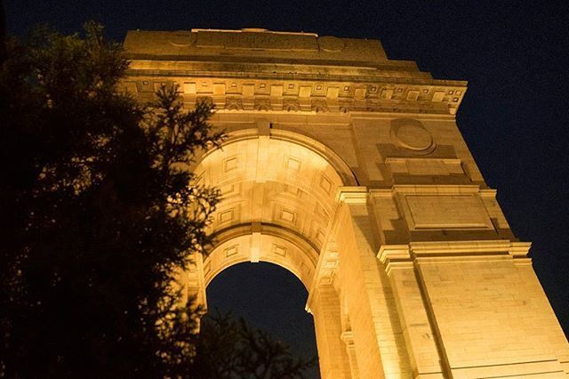 architecture, built structure, building exterior, low angle view, history, night, arch, famous place, travel destinations, facade, illuminated, religion, place of worship, sky, clear sky, travel, tourism, spirituality, outdoors