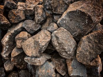 
piles of river stones as building materials