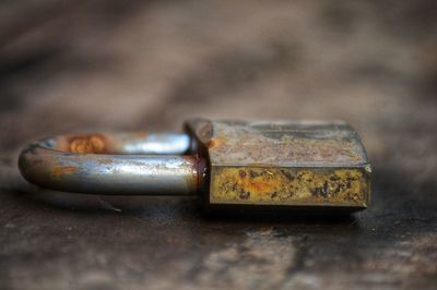 Close-up of rusty metal on table