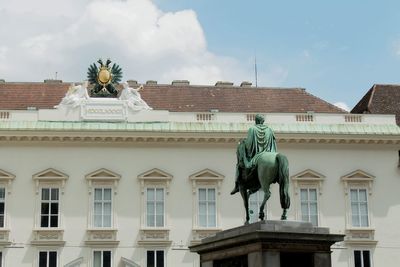 Low angle view of statue against sky