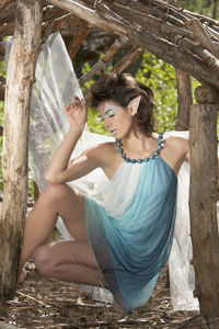 Young female elf sitting in your house