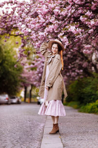 Young woman standing on road