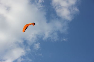 Low angle view of parachute against sky