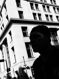 Woman standing in front of building