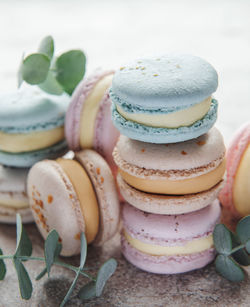 Beautiful colorful tasty macaroons on a concrete background