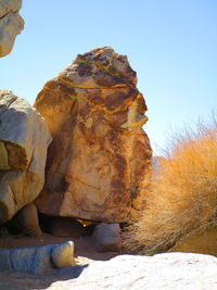 Low angle view of rock formation against clear sky