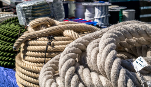 Close-up of ropes for sale at harbor