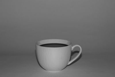 Close-up of coffee cup on table