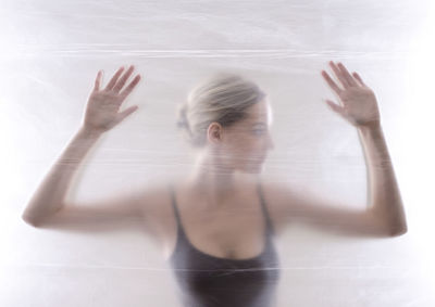 Woman seen through window