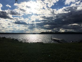 View of calm sea against cloudy sky