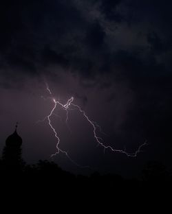 Low angle view of illuminated building against sky