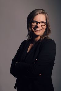 Portrait of a smiling young woman against white background