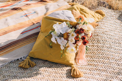 High angle view of flower bouquet on pillows