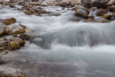 Scenic view of waterfall in sea