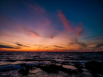 Scenic view of sea against sky during sunset