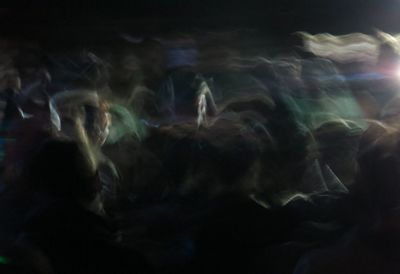 Blurred motion of people at night