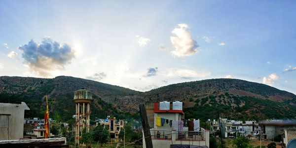 Houses and buildings against sky