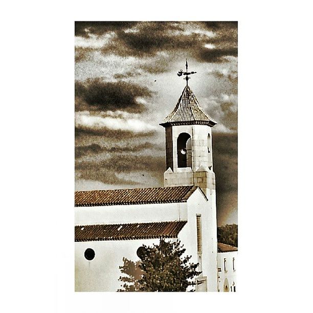 religion, church, architecture, built structure, place of worship, spirituality, building exterior, cross, low angle view, sky, clock tower, tower, cathedral, steeple, tree, high section, auto post production filter, transfer print