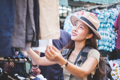 Woman wearing hat at store