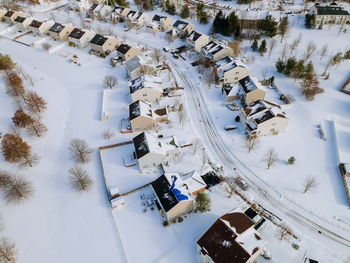 High angle view of trees and buildings during winter