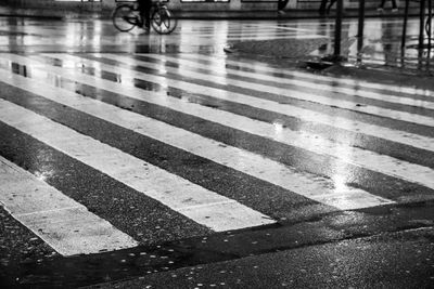 Zebra crossing on road in city during rainy season