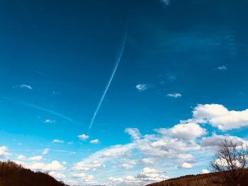 Low angle view of vapor trail in sky