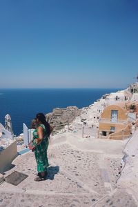 Female tourists enjoying the view of oia