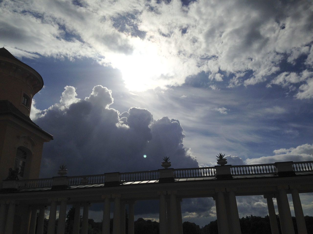 LOW ANGLE VIEW OF BRIDGE AGAINST SKY AND SILHOUETTE BUILDING