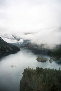 Scenic view of lake and mountains against sky