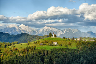 Scenic view of landscape and mountains against sky