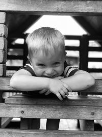 Portrait of smiling cute boy in jungle gym