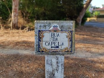 Close-up of sign on field