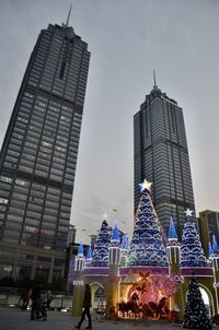 Low angle view of modern buildings against sky in city