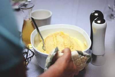 Close-up of hand holding ice cream