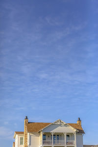 Low angle view of buildings against blue sky