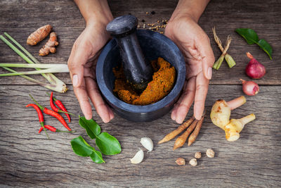 Cropped hands using mortar and pestle