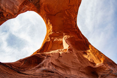 Low angle view of rock formation against sky