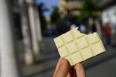 Close-up of hand holding ice cream cone